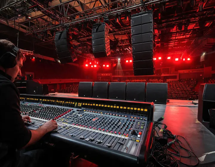 Martin Audio flown line array over a controlled venue stage